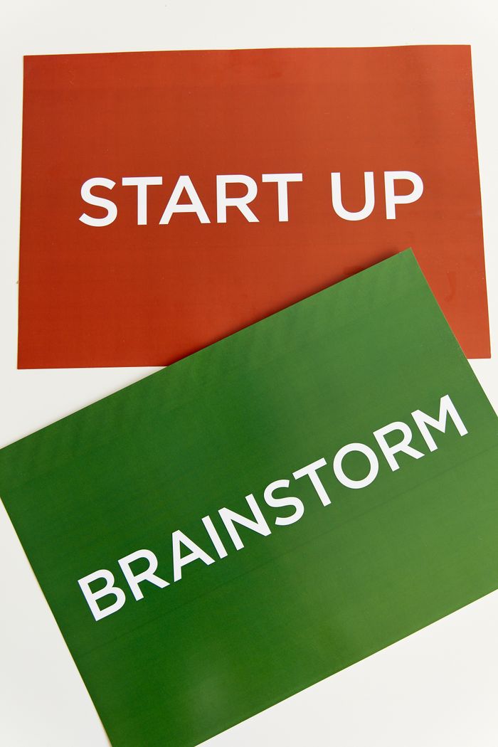 Vertical colorful placards with the words Start Up and Brainstorm, ideal for business concepts.